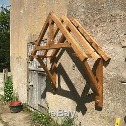 Green oak door canopy kit 1150 between gallows. Oak door porch. Self build porch